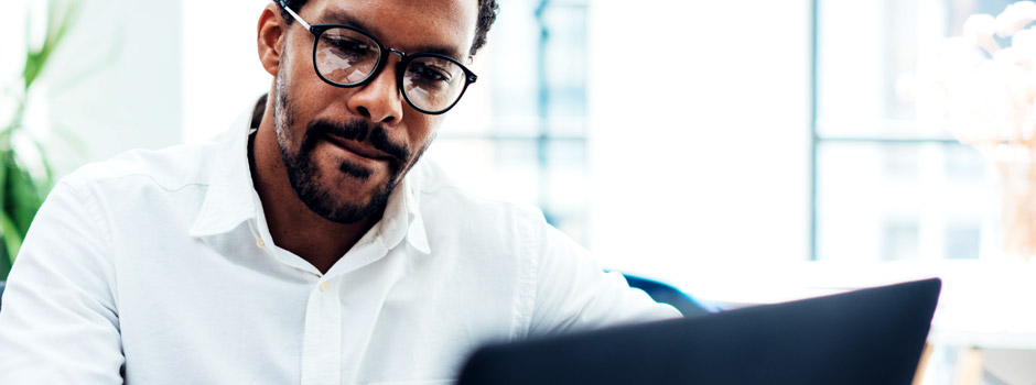 A man utilizing workflow solutions implemented by Edge Business Systems Workflow Solutions