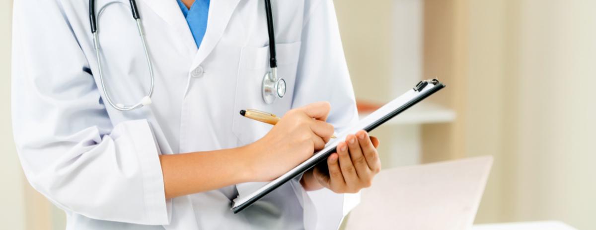 healthcare worker holding documents on clipboard