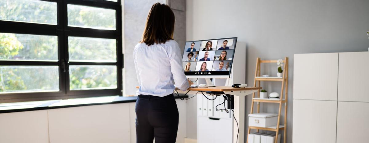 Woman employee working from home while on video call meeting.