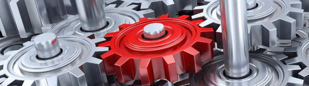 gray gears with one isolated red gear